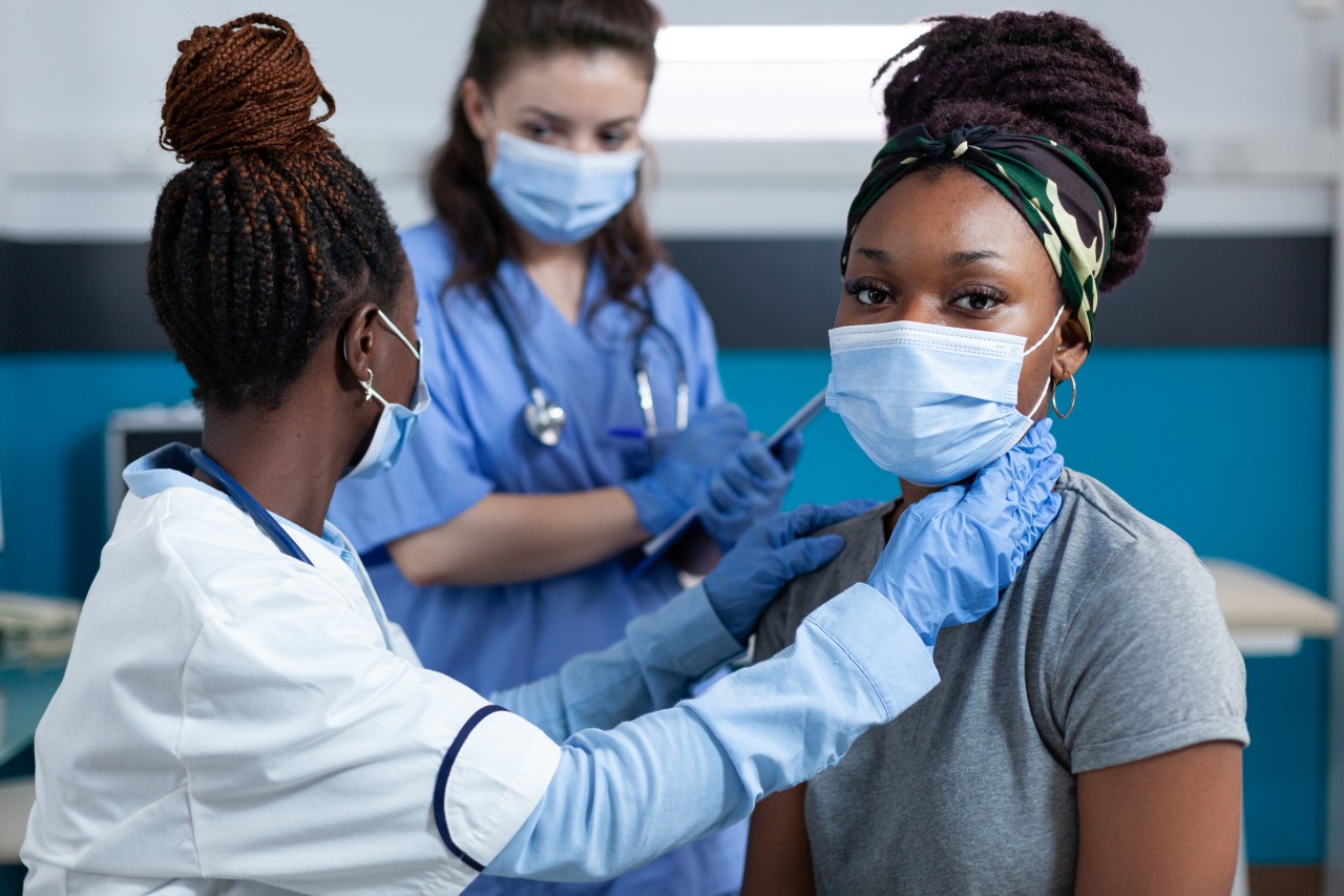 african-american-doctor-mesauring-cardiac-pulse-while (1)